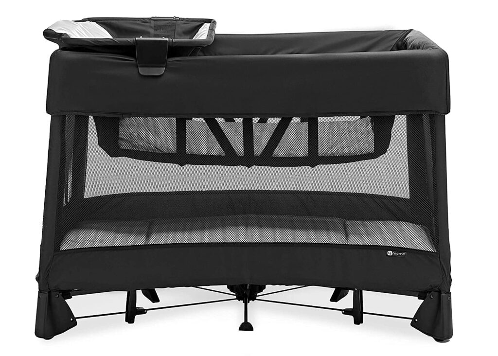 Best Travel Crib for Toddlers in 2026 4moms Breeze Plus Portable Playard and Travel Crib in black, shown assembled on a white background with its attached changer.