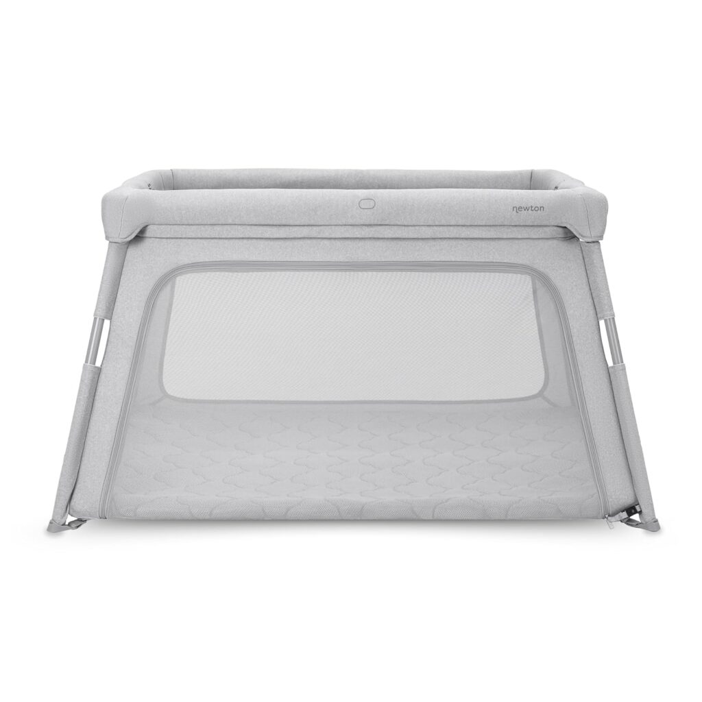 Best Travel Crib for Toddlers in 2026 Newton Baby Travel Crib and Playard in grey with a breathable mattress and large mesh windows.