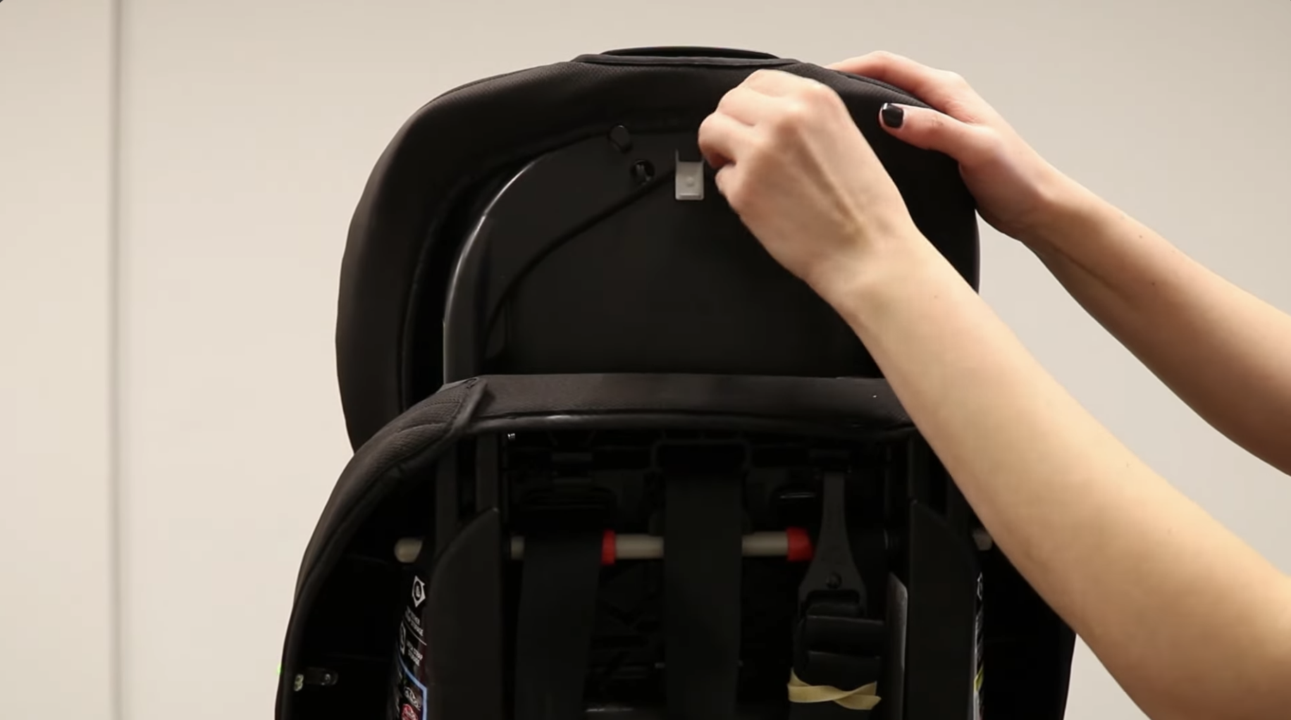 Head support cover partially removed showing snap locations