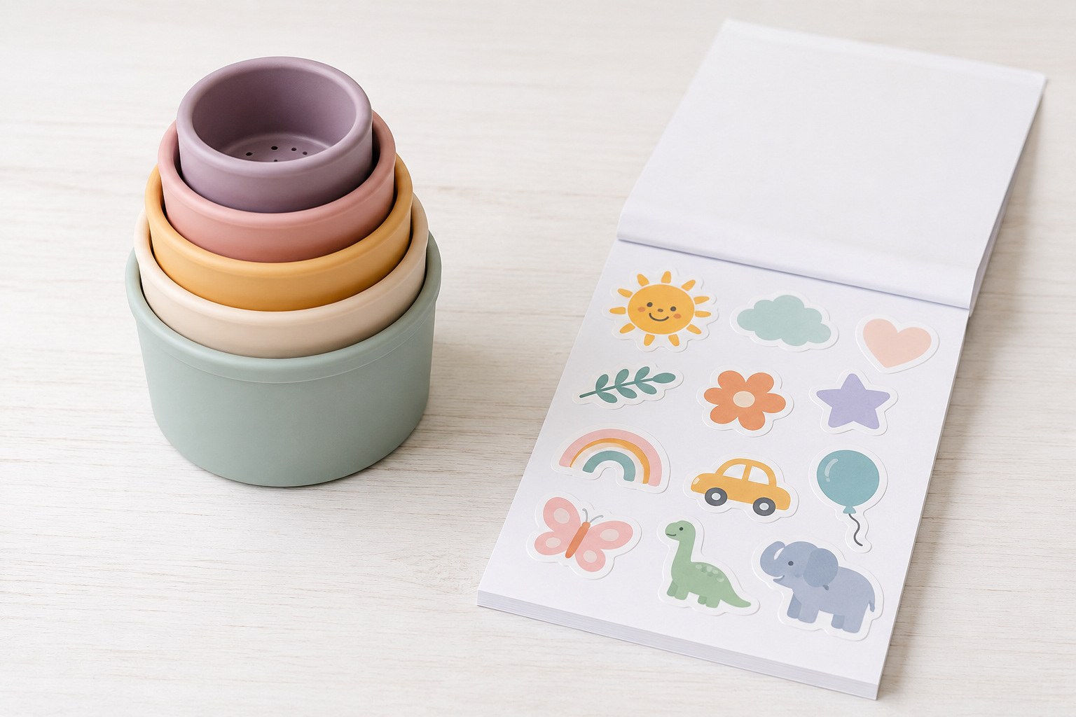 What Toys Keep an 18-Month-Old Quiet on a Plane? (The Wrapping Paper Trick) Best toddler plane toys including stacking cups and sticker pads